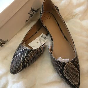 A new day snake print flats. Brand new.